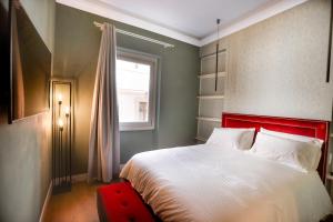 Ένα ή περισσότερα κρεβάτια σε δωμάτιο στο Bargello - Signoria Luxury