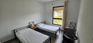 Katil atau katil-katil dalam bilik di T3 de standing Vigna Majo vue mer imprenable