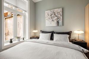 Ένα ή περισσότερα κρεβάτια σε δωμάτιο στο Rosen Apartment