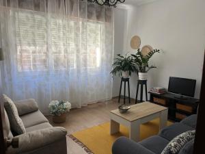 a living room with a couch and a table at Casablanca 95 in Vigo