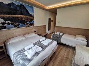 Ένα ή περισσότερα κρεβάτια σε δωμάτιο στο Verdi Armonie Rooms and Wellness