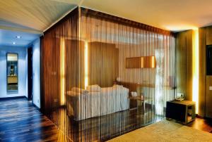 a lobby with a white couch in a room at NH Collection Madrid Palacio de Tepa in Madrid