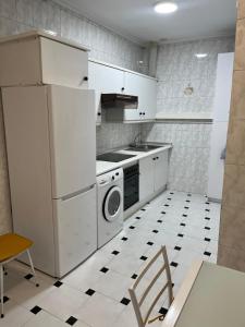a kitchen with a refrigerator and a stove and a dishwasher at Casablanca 95 in Vigo +27 photos