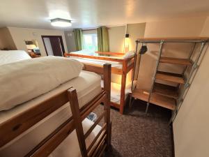 Ένα ή περισσότερα κρεβάτια σε δωμάτιο στο Newgale Lodge