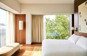 A bed or beds in a room at Park Hyatt Zurich – City Center Luxury