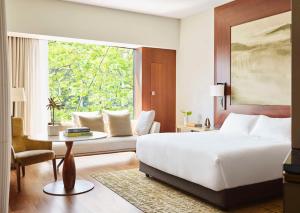 A bed or beds in a room at Park Hyatt Zurich – City Center Luxury