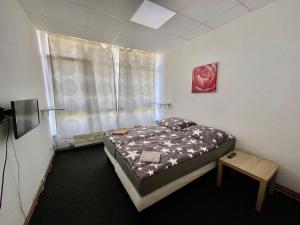 Postel nebo postele na pokoji v ubytování Apartmany Fit Gym