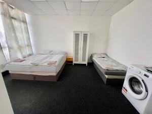 Postel nebo postele na pokoji v ubytování Apartmany Fit Gym