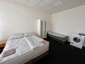 Postel nebo postele na pokoji v ubytování Apartmany Fit Gym