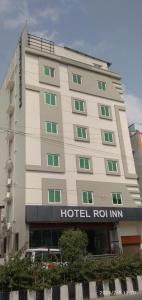 a hotel building with a hotel roin sign on it at Hotel Roi Inn in Tirupati