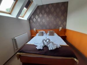 Postel nebo postele na pokoji v ubytování Hotel Platan