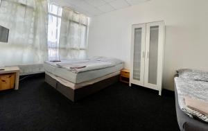 Postel nebo postele na pokoji v ubytování Apartmany Fit Gym