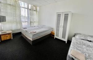 Postel nebo postele na pokoji v ubytování Apartmany Fit Gym