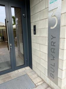 a door to a building with a sign on it at Penthouse21 in Oświęcim
