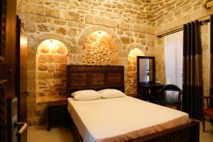 Postel nebo postele na pokoji v ubytování Minessa Konağı