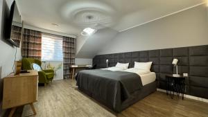 Posteľ alebo postele v izbe v ubytovaní Apartamenty Leśna 1