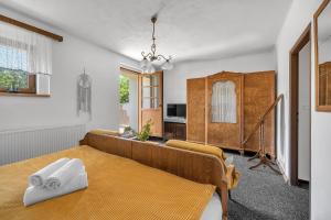 a bedroom with a bed in a room at Hotel PODKOST in Libošovice