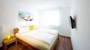 Łóżko lub łóżka w pokoju w obiekcie Appartementhaus Fritz-Rosenkranz