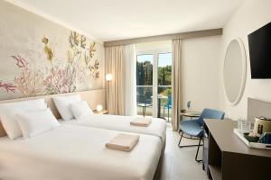 Maistra Select Astarea Hotel客房内的一张或多张床位