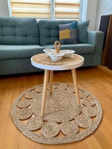 a coffee table in a living room with a couch at Asinela Home с гараж in Burgas City