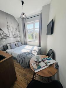 Televízia a/alebo spoločenská miestnosť v ubytovaní Property Apart - Ruska Centrum