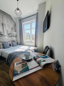 Posteľ alebo postele v izbe v ubytovaní Property Apart - Ruska Centrum