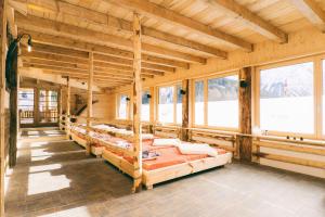 A bed or beds in a room at Almi's Berghotel