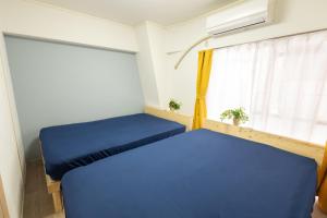 Postel nebo postele na pokoji v ubytování LN08 三宮14名まで宿泊可能な三宮元町駅至近貸切3LDKroom