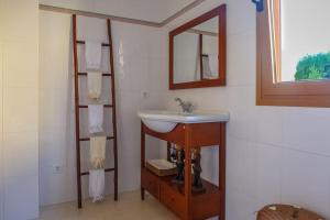 a bathroom with a sink and a mirror at BEACH VILLA with PRIVATE POOL in Palma de Mallorca +15 photos