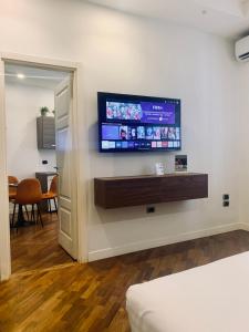 a room with a flat screen tv on a wall at Napoliday in Naples +32 photos