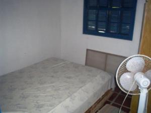 Postel nebo postele na pokoji v ubytování cod 109 - Casa simples com uma excelente localização + 2 fotografie