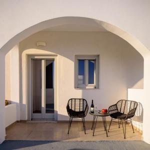 two chairs and a table on a patio at Elia Pyrgos in Pyrgos
