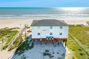 an aerial view of a house on the beach at Unobstructed Oceanfront SAND DOLLAR Unit 7 Beach Pad! in Surfside Beach