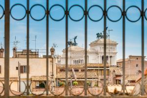 a view of a building from behind a fence at Relais Badoer in Rome