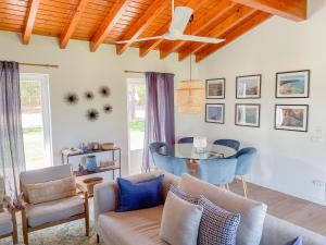 a living room with a couch and a table at Monte dos Pinheiros in São Teotónio