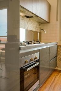 a kitchen with a stainless steel stove top oven at Belle Viste - Boutique Apartments in Bettolle