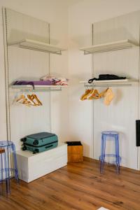 a room with two stools and a room with bunk beds at Belle Viste - Boutique Apartments in Bettolle