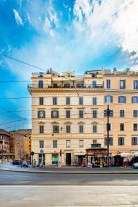 a large building on the corner of a street at Relais Badoer in Rome