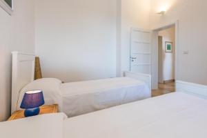 A bed or beds in a room at Adriatic villa