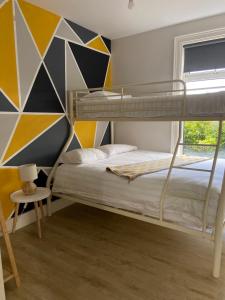 Postel nebo postele na pokoji v ubytování Ocean Breeze