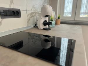 a white appliance sitting on top of a kitchen counter at La Piazzetta in Torre del Greco
