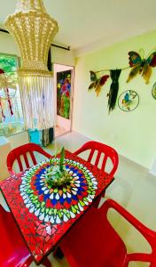 a table with a colorful table cloth on it at Sol y Luna apartment in Santa Marta