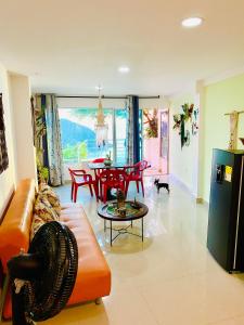 a living room with a couch and a table at Sol y Luna apartment in Santa Marta
