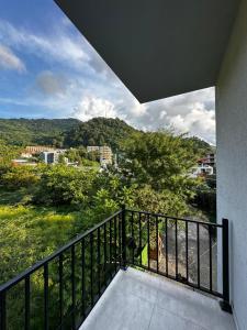 a balcony with a view of a city at New House Gonio in Batumi