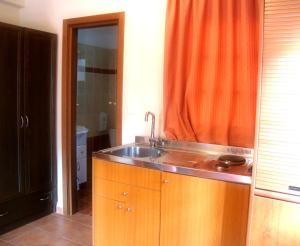 A kitchen or kitchenette at Enalion Hotel