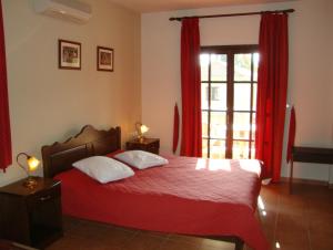 A bed or beds in a room at Enalion Hotel