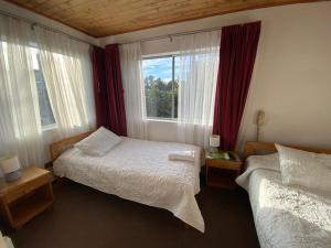 Postel nebo postele na pokoji v ubytování Hotel Küyen-Ko Pucón