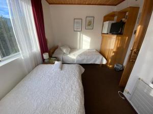 Postel nebo postele na pokoji v ubytování Hotel Küyen-Ko Pucón