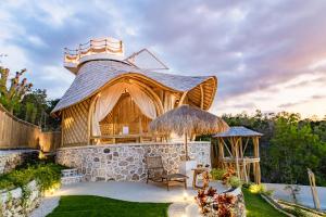 a gazebo in a yard with a building at Camanta Penida - Panoramic Sea & Romantic Escape in Nusa Penida +106 photos