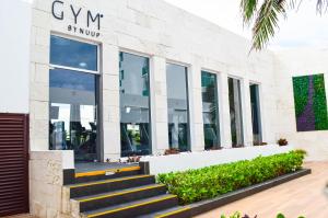 a building with stairs in front of it at New studio at the Beach, pool, gym, spa 2D in Cancún